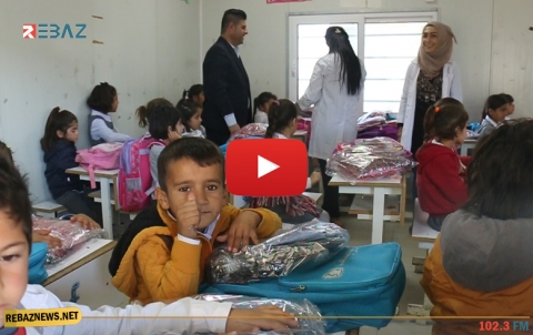 مخيم قوشتبة..الیونیسیف توزع ثياب شتوية مدرسية على 1400 طالب